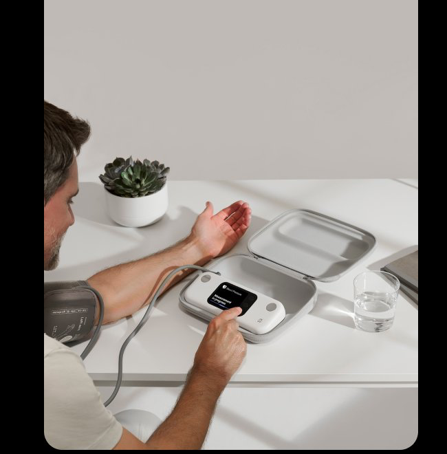 Patient taking a blood pressure measurement at home